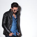 Side view of a fashion man in leather jacket Royalty Free Stock Photo