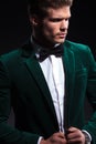 Side view of a fashion model in green velvet suit Royalty Free Stock Photo