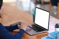 Female freelance working with laptop computer at her comfortable workspace. Royalty Free Stock Photo