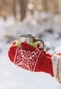 Side view of female hand holding hot cup of coffee in winter Royalty Free Stock Photo