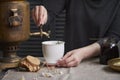 Side view of female hands pouring cup of tea from vintage samovar and jar of homemade jam, tea party concept Royalty Free Stock Photo