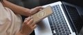 Female hands using mock up smartphone and laptop on her lap Royalty Free Stock Photo