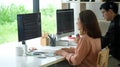 Side view of female programmer working with computer at modern office. Developing programming Royalty Free Stock Photo