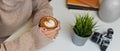 Side view of female in sweater hands holding a cup of coffee Royalty Free Stock Photo