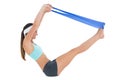 Side view of a fit woman exercising with a blue yoga belt Royalty Free Stock Photo