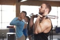 Side View - Fit Young Lifting Barbells in Gym.