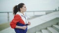 Side view of fit young woman running up stairs. Female athlete running up the steps. Royalty Free Stock Photo