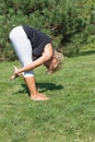 Side view of flexible senior woman stretching exercise