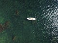 Top view on blonde woman in yellow bikini relaxing on the sup board. Young attractive woman in the sea on the Stand Up Royalty Free Stock Photo