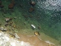 Top view on blonde woman in yellow bikini relaxing on the sup board. Young attractive woman in the sea on the Stand Up Royalty Free Stock Photo