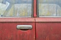 Side view fragment of an old red car