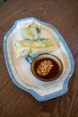 Side view of fresh Vietnamese spring rolls, cold, with dipping sauce with peanuts Royalty Free Stock Photo