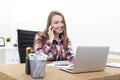 Side view of girl on phone in office