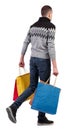 Side view of going man with shopping bags Royalty Free Stock Photo