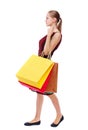 Side view of going woman with shopping bags . Royalty Free Stock Photo