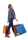 Side view of going woman with shopping bags Royalty Free Stock Photo