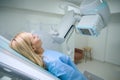 Adult woman undergoing radiological examination in clinic Royalty Free Stock Photo