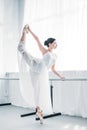 side view of graceful flexible young ballerina practicing ballet Royalty Free Stock Photo