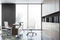 Side view of gray CEO office with bookcase Royalty Free Stock Photo