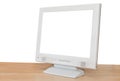 Side view of grey computer display on wood table