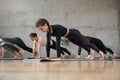 Group of women doing plank exercice in hall. Royalty Free Stock Photo