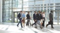 Group of diverse business people walking together in lobby office