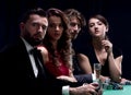 Side view of group of people playing poker together in casino Royalty Free Stock Photo