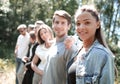 Side view of a group of serious young men standing together Royalty Free Stock Photo