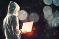 Side view of hacker in hoodie using laptop while standing on abstract hacking background with bokeh circles and binary coding Royalty Free Stock Photo