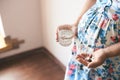 Pregnant woman waiting for baby and taking vitamins Royalty Free Stock Photo