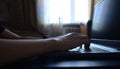 side view hands typing on a laptop, a person writing an email, working on the internet Royalty Free Stock Photo