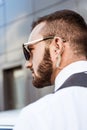 side view of handsome security guard with security earpiece