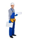 Side view of happy construction worker in uniform with toolbox a Royalty Free Stock Photo