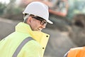 Side view of happy male supervisor at construction site Royalty Free Stock Photo