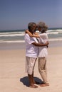 Senior couple head to head and embracing each other on beach Royalty Free Stock Photo