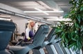 A side view of senior woman in gym doing cardio work out exercise. Royalty Free Stock Photo