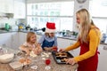 Family making Christmas cookies at home Royalty Free Stock Photo