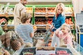 side view of happy young family with two kids shopping together Royalty Free Stock Photo