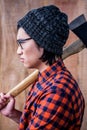 Side view of hipster holding a axe Royalty Free Stock Photo