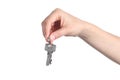 Side view of home keys hanging from a woman hand