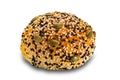 Side view of homemade burger bun sprinkled with white and black sesame and pumpkin seeds Royalty Free Stock Photo