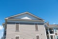 Side view of house building. house roof on blue sunny sky background. Architecture and structure. design concept. rent Royalty Free Stock Photo