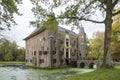 Side view of Huis te Linschoten with bridge over the pond on the Linschoten estate Royalty Free Stock Photo