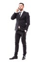 Handsome business man talking on the mobile phone on white background Royalty Free Stock Photo