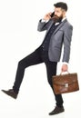 Side view of a hurrying business man talking on the mobile Royalty Free Stock Photo