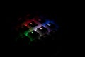 Side view of illuminated RGB keycaps keys in the dark Royalty Free Stock Photo