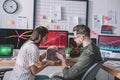 Side view of information security analysts using charts while testing security