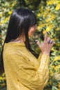 Side view of Kali mudra executed by a woman over nature background