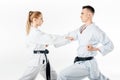 side view of karate fighters exercising in kimono