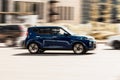 Side view of Kia Soul car in motion. Blue compact hatchback moving fast on the street Royalty Free Stock Photo